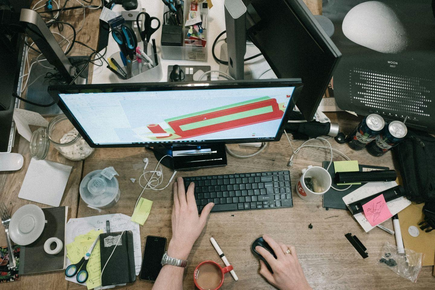 Cluttered desk representing financial overwhelm